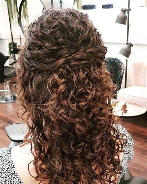 A Stunning Natural Brides Half Up Look Curly Bridal Hair Hairdos For