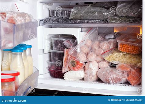 Refrigerator With Frozen Food Meat Milk Fruits And Vegetables Stock