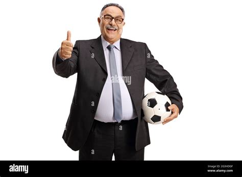 Exctied Mature Man In Suit And Tie Holding A Football And Gesturing