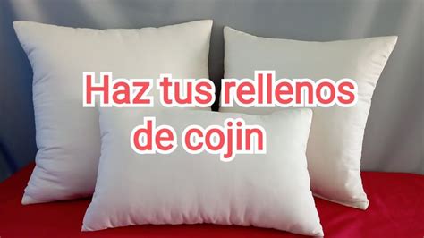 Two White Pillows With The Words Haz Tus Rellenos De Cooinn On Them