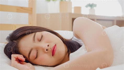 Asian Woman Dreaming While Sleeping On Bed In Bedroom Beautiful