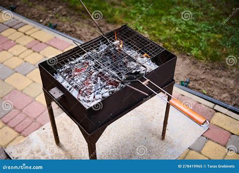 Top View Empty Grill Grate Over Flaming Charcoals On The Barbeque Grill