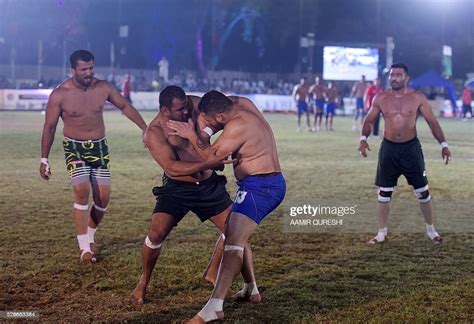 A Pakistani Kabaddi Player Tries To Tackle An Indian Opponent During