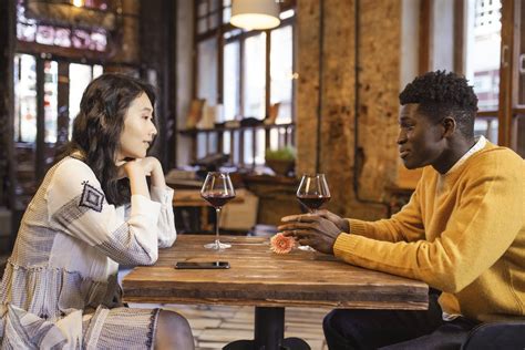 Man And Woman Sitting At Table · Free Stock Photo