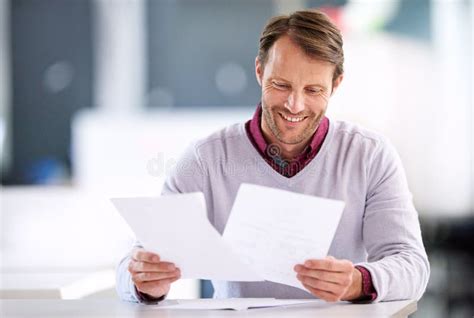 I Finally Got All This Paperwork Sorted A Mature Businessman Reading