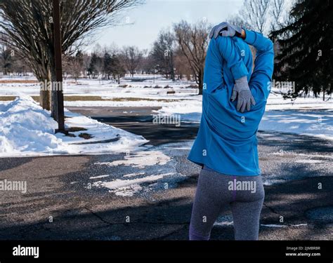 Woman Warming Up Stretching Her Arms Before Her Early Morning Exercise