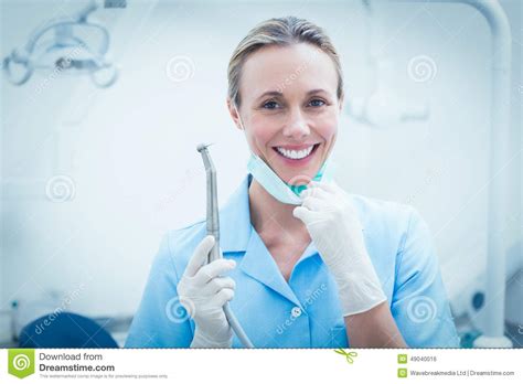 Female Dentist Holding Dental Tool Stock Photo Image Of Stomatology