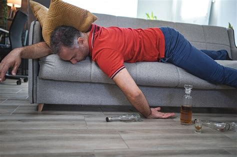 Premium Photo Drunk Man Sleeping On A Sofa