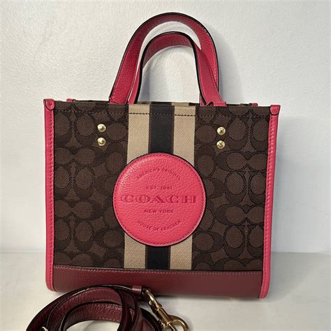 Coach Dempsey Tote 22 on Carousell