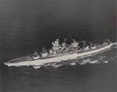 an old photo of a large ship in the middle of the ocean, taken from above