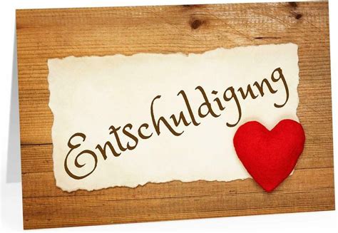 A Piece Of Paper With The Word Entschling On It And A Red Heart