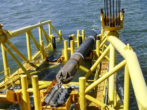 Laying Of Pipes With Pipe Laying Barge Crane Near The Shore Descent Of