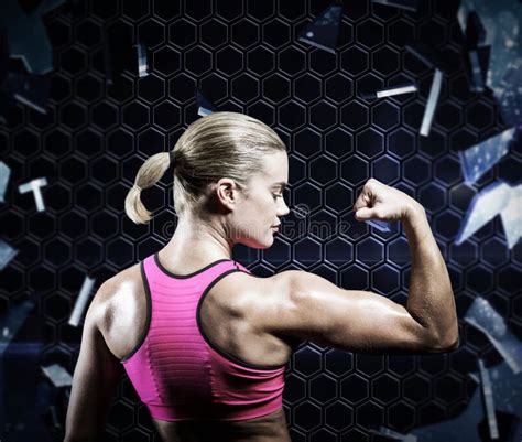 Composite Image Of Muscular Woman Flexing Her Arm Stock Image Image