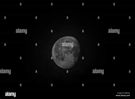 The moon at Waxing gibbous phase. Focus on lunar rugged surface of ...