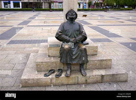 The Feet Of A Bronze Statue Of A Pilgrim In The Plaza San Marcos In