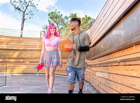 Alternative Diverse Couple Hanging Out Together Chilling And Smiling