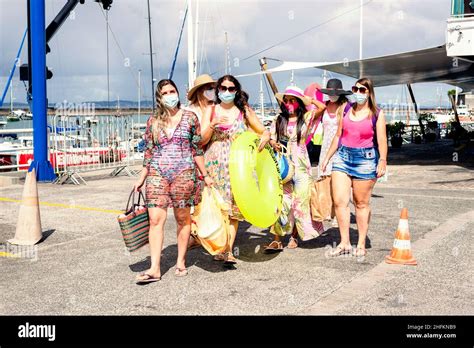 Women Walking In Bikini With Beach Accessories Salvador Bahia Brazil