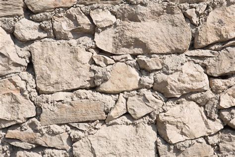 Masonry Walls Of Natural Sand Color Stone Texture Close Up