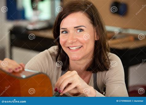 Happy Woman Fixing Guitar Stock Image Image Of Leisure