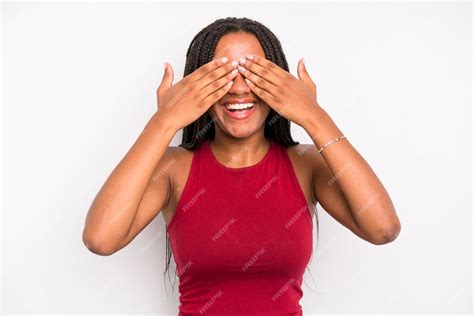 Premium Photo Smiling And Feeling Happy Covering Eyes With Both Hands