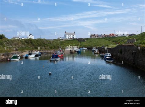 Boats In The Small Harbour At Seaton Sluice With The Kings Arms Pub