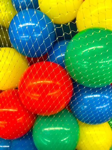 Plastic Colored Balls In Grid Stock Photo - Download Image Now ...