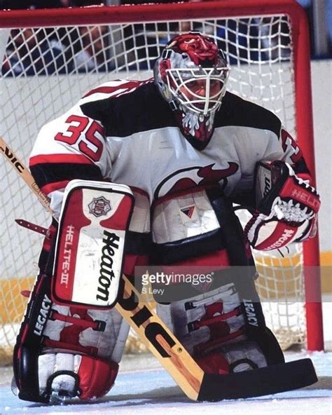 The Goalie Is Ready To Take His Place In The Net During A Hockey Game