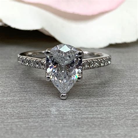 Moissanite Forever One Pear Shape And Round Accents Etsy Moissanite