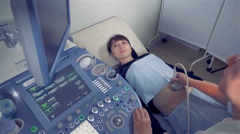 Female Gynecologist Is Carrying Out An Ultrasound Procedure On A