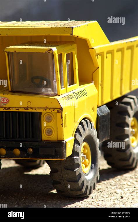 Side View Of Battered Yellow Toy Tonka Dump Truck Stock Photo Alamy