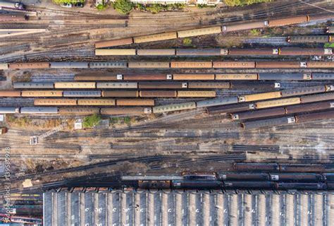 Freight And Passenger Train Waiting At The Train Station Parking Lot