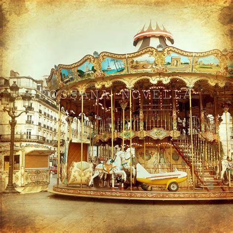 an old fashioned carousel with horses and carriages