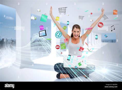 Digital Composite Of Cheering Blonde Using Laptop With App Icons Stock