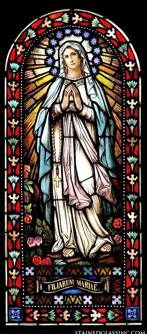 A Stained Glass Window Depicting The Virgin Mary