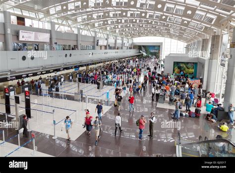 People in the baggage check in area, Juan Santamaría International ...