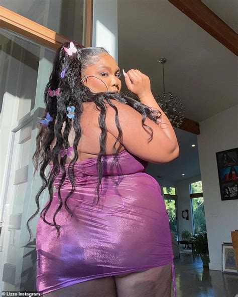 Lizzo Proudly Twerks As She Poses In A See Through Purple Mini Dress