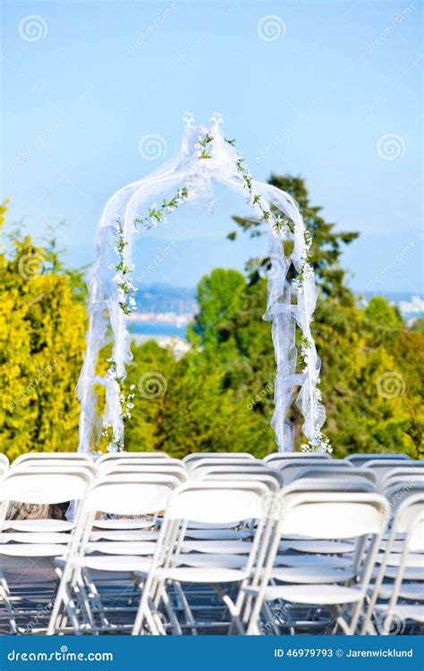 White Metal Folding Chairs Lined Up For Outdoor Wedding With Arb Stock Photo - Image: 46979793