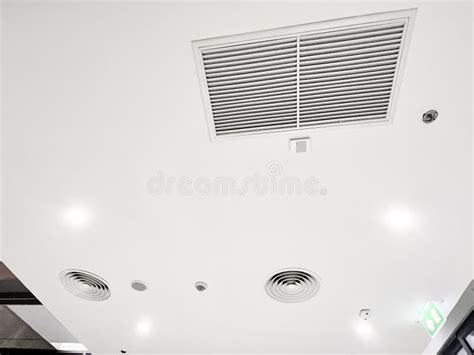 Ceiling Mounted Cassette Type Air Conditioner And Modern Lamp Light On White Ceiling Duct Air