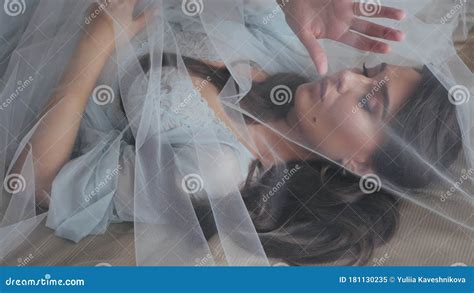 Close Up Top Shot Of Beautiful Bride In Turquoise Lingerie Which Lies On A Cozy Bed In An