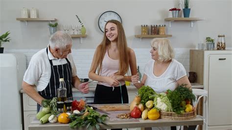 Mature Grandparents Couple Granddaughter Kitchen Girl Stock Footage Video 100 Royalty Free