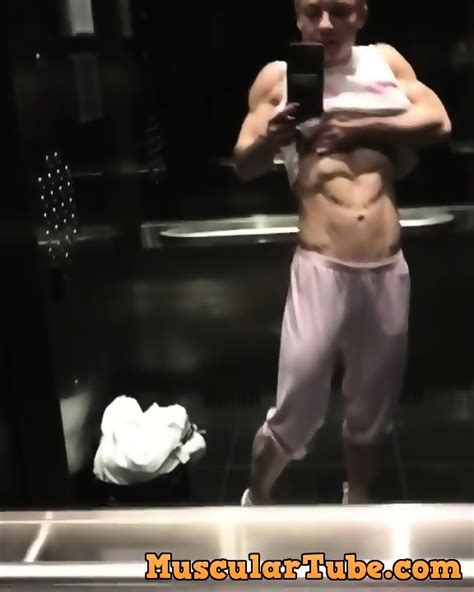 Stunning Blonde Muscle Woman Admires Herself In Elevator Mirror