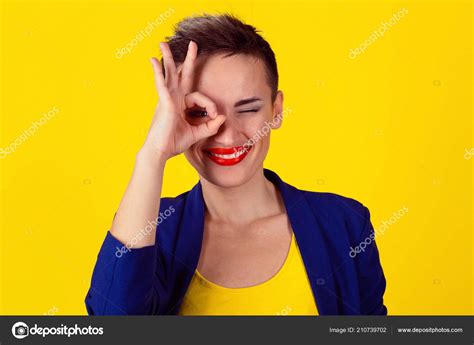 Woman Her Fingers One Eye Sign Hand Gesture Isolated Yellow Stock Photo