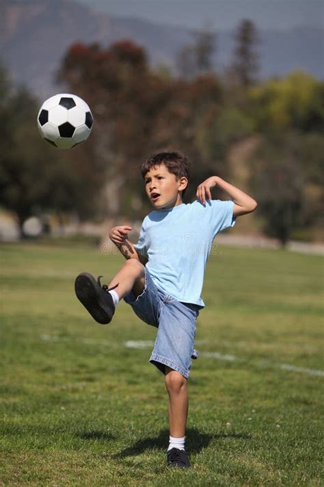 Boy Kicking Soccer Ball Stock Image Image Of Losing 24075431