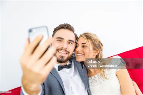 Young Lover Married Couple In Wedding Dress Doing Selfie Together Stock