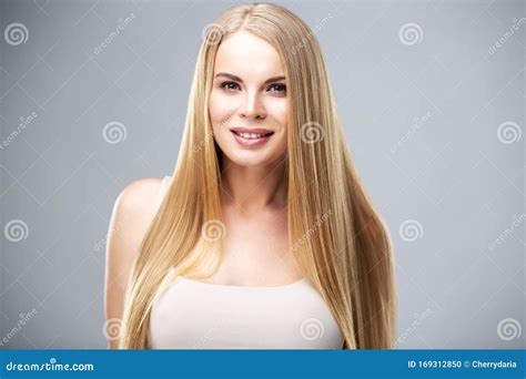 Beautiful Blonde Woman With Shiny Long Straight Hair And Natural Fresh