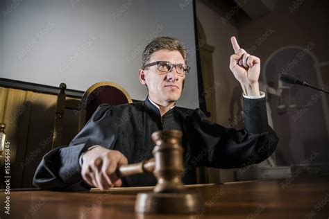 A Judge With A Hammer In His Hand In The Court Room Stock Photo Adobe