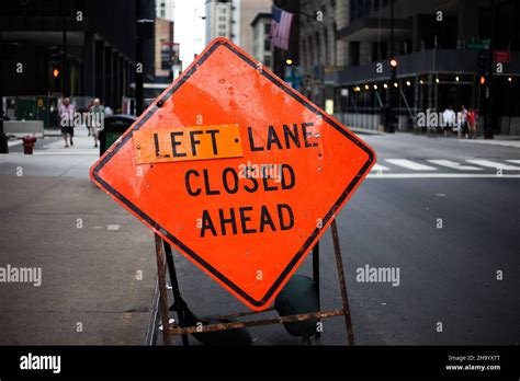 Sign left Lane closed ahead Stock Photo - Alamy