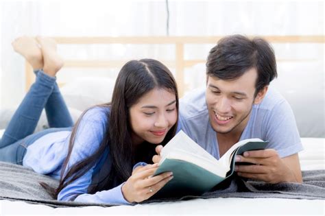 Premium Photo Couple Reading A Book Together In Bedroom