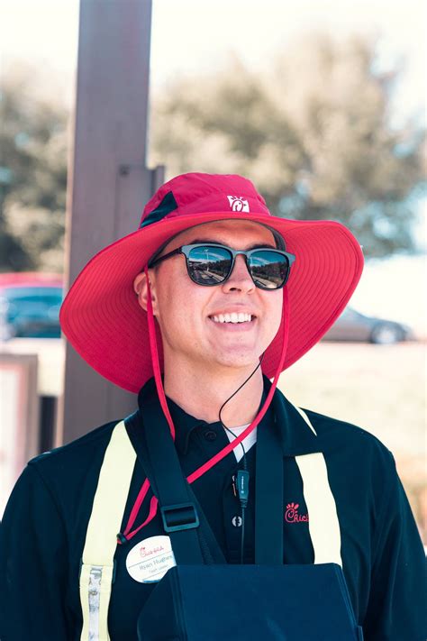 Man Wearing Red Hat And Black Polo Shirt · Free Stock Photo