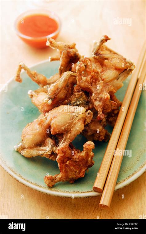 Deep-fried frog's legs Stock Photo - Alamy